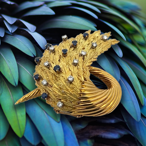 Diamond, sapphire and gold brooch.