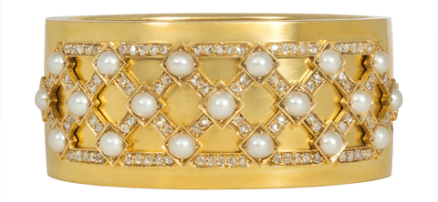 Victorian 15-karat gold bangle with a lattice of diamonds and natural pearls, English, inscribed “wedding present to Margaret Leicester Warren from the Galley Genantry, 1875”.