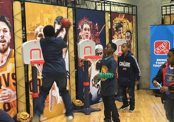 Kids playing with Step2 basketball hoops