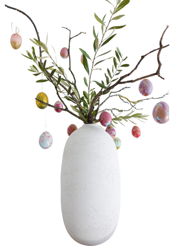 Easter tree decor. Homemade Easter tree using decorated eggs and olive tree branches, with other assorted branches.