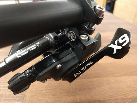 The MisMatch adapter is installed onto handlebars with a shifter and brake lever.