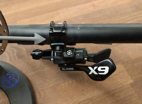 A shifter is shown installed on handlebars