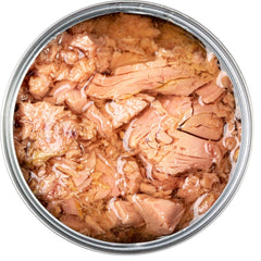 an opened can with tuna meat inside