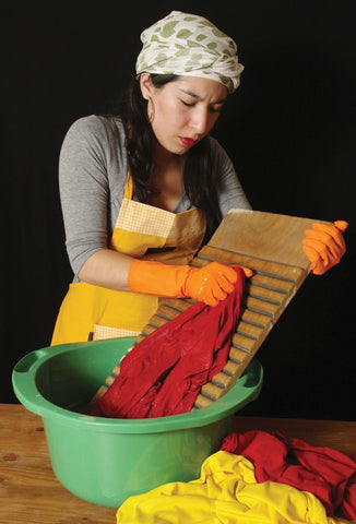 woman washing clothes with washboard
