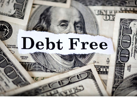 picture of money with the words "debt free" in the middle