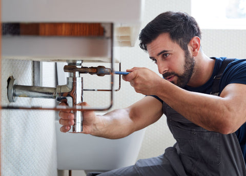 man doing plumbing repair