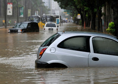 a picture of a car submerged in flood water