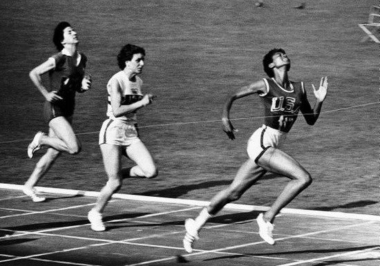 Rudolph wins the women's 100 meter dash at the 1960 Summer Olympics in Rome.