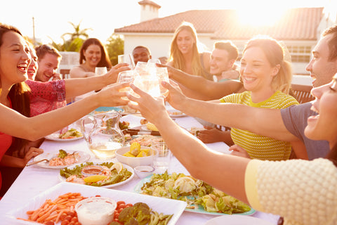 summer bbq with friends clinging stemless wine glasses | Alterre