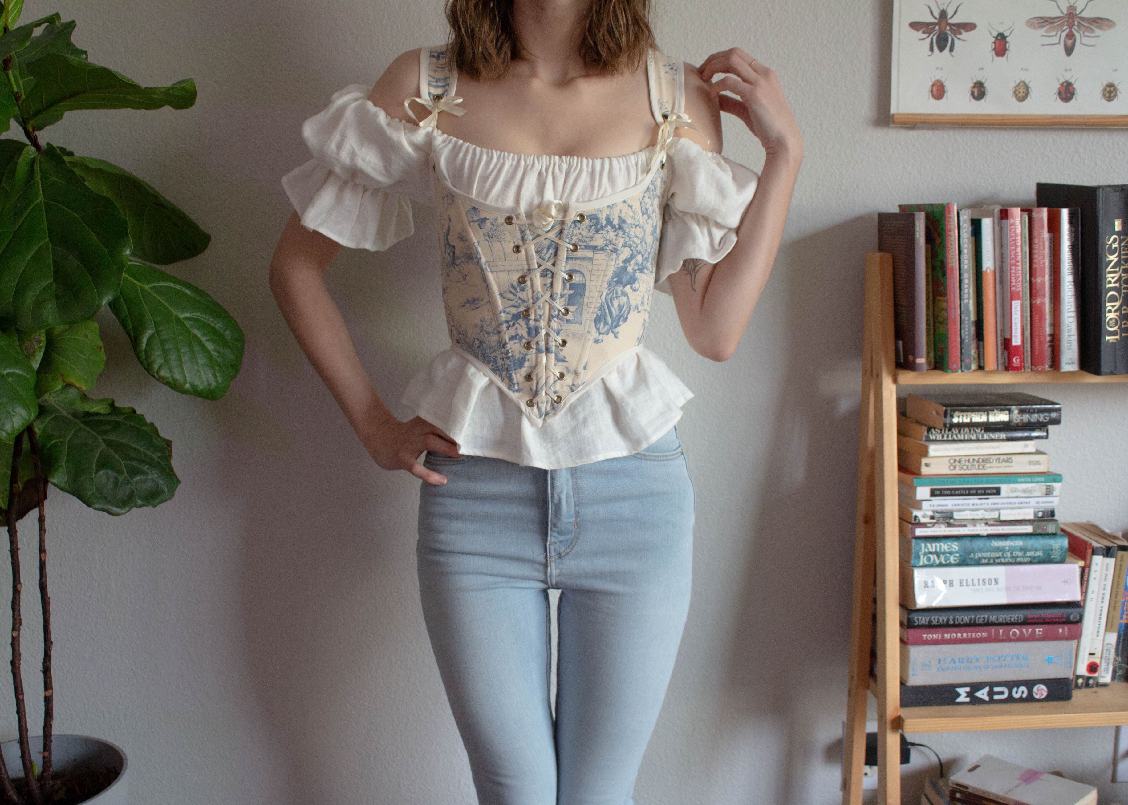 Corset top styled with jeans and a short sleeve peasant blouse