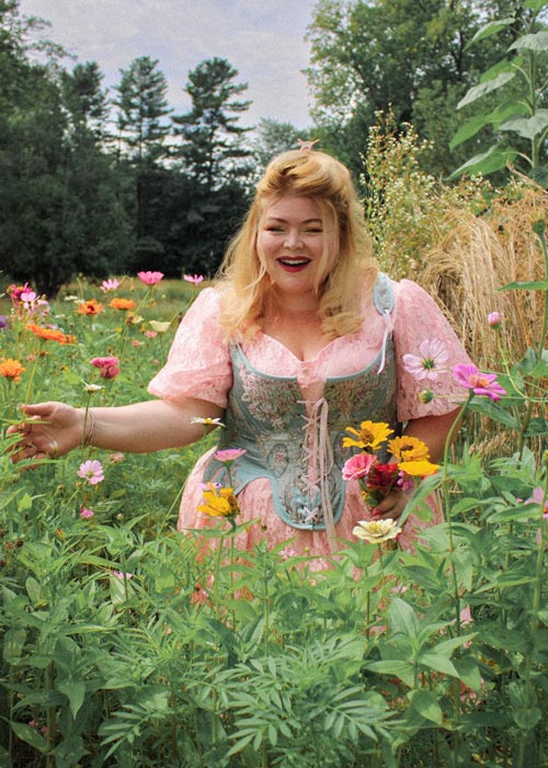 plus size corset on model picking flowers