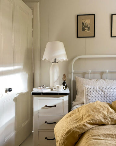 Bedroom with scallop lampshade