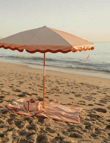 pink and red scalloped parasol umbrella