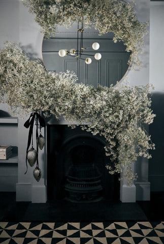 snowy garland on fire place