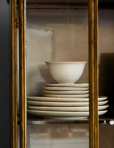 Tableware in display cabinet