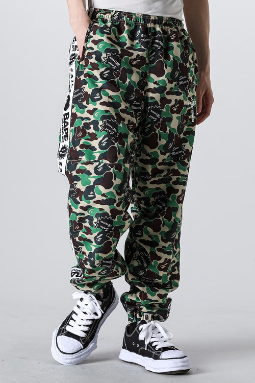 A BATHING APE® × SAINT Mxxxxxx STAPE Track Pants - SAINT Mxxxxxx