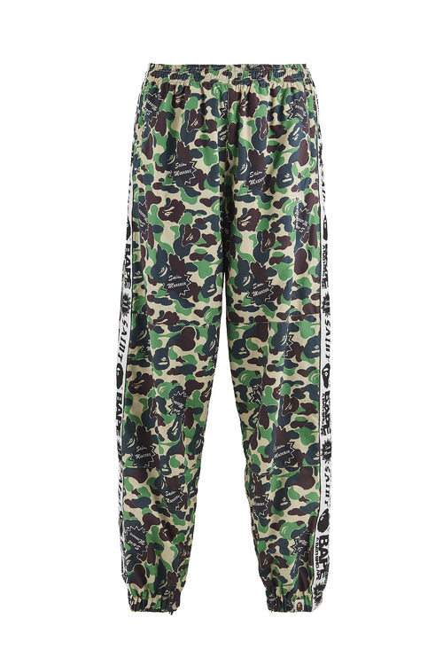 A BATHING APE® × SAINT Mxxxxxx STAPE Track Pants - SAINT Mxxxxxx