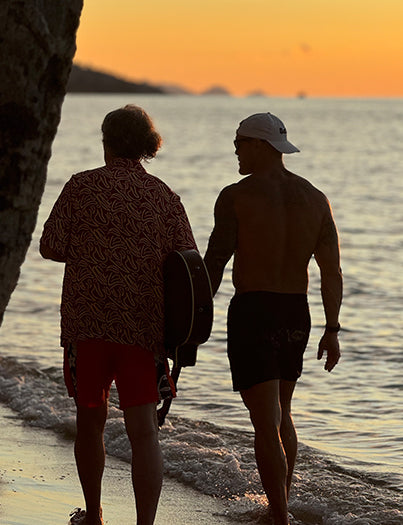 The picture shows the founder of Lumaflex walking by the seaside