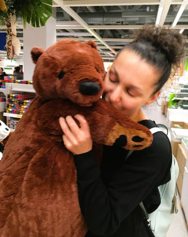 Bio photo where I kiss a giant cuddly teddy bear.