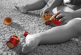 Toddler Playing with a Nesting Doll