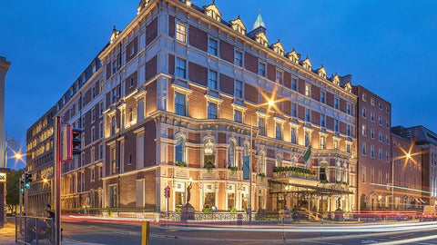 Hotel exterior night shot, with impressively lit high-rise building in Dublin