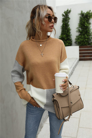 A women wearing camel sweater