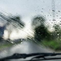 Photo of a windshield with rain on it