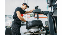 Tire shop putting a tire on a rim