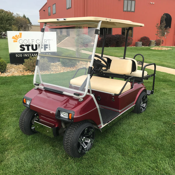 Polished stainless steel rocker panels and bumper installed on Club Car DS model golf cart.