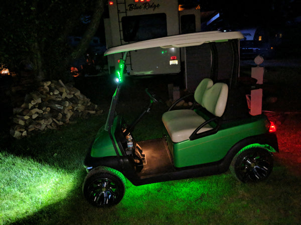 Deluxe street legal LED light kit installed on a Club Car Precedent shining at night.