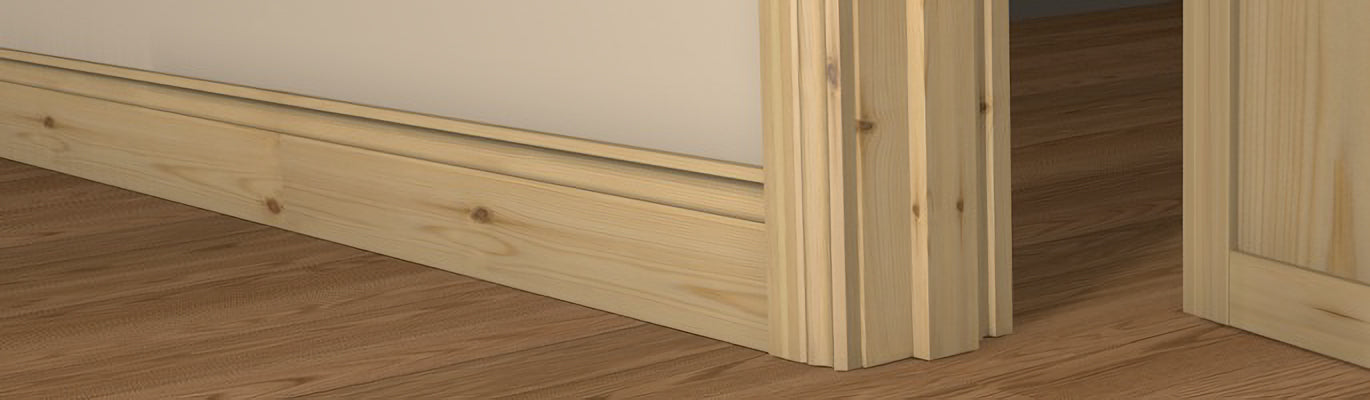 Pre-Varnished Redwood Fire Door Frame shown fitted within a doorway, complimented by architrave on each side