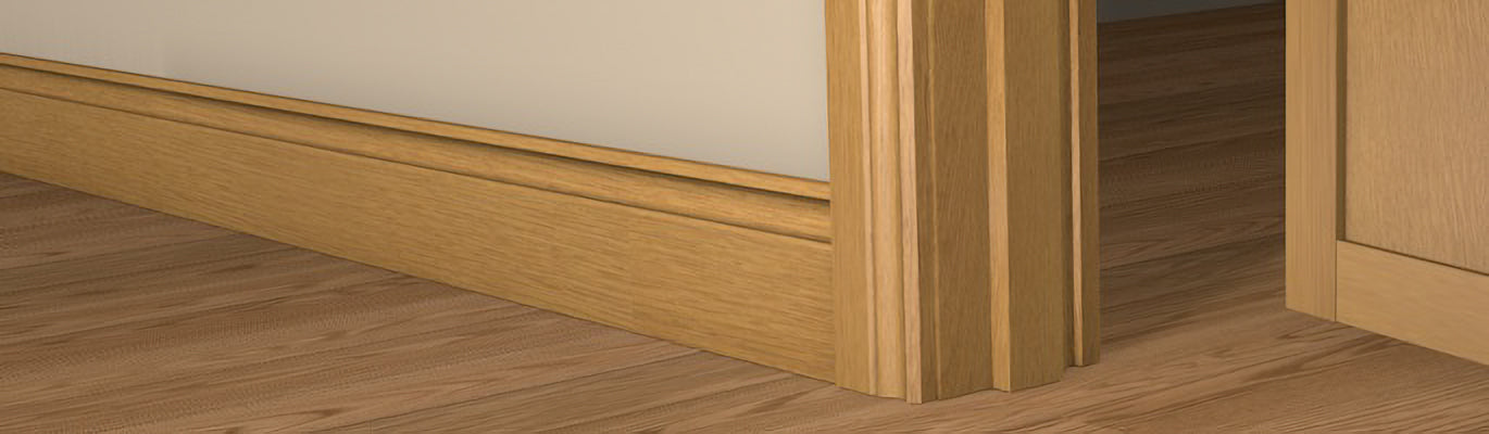 Pre-Varnished Solid Oak Faced Fire Door Frame shown fitted within a doorway, complimented by architrave on each side