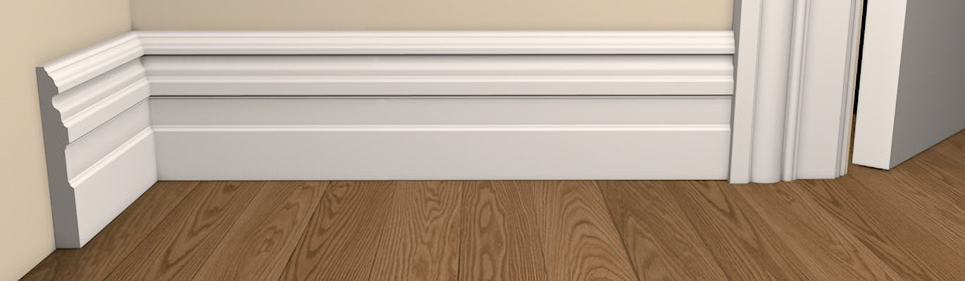 Period Style Owel Architrave and Skirting - Pre-Primed/Pre-Painted Wood shown fitted to a wall