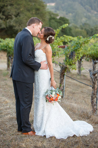 Bride and Groom in the grapevines, flowers by Gorgeous and Green in Napa Calistoga Hans Fahden Winery 
