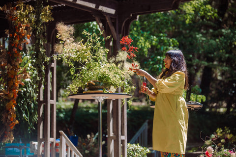 Pilar Demonstrates Sustainable Flower design techniques in a vintage vessel with local grown and foraged flowers and foliage