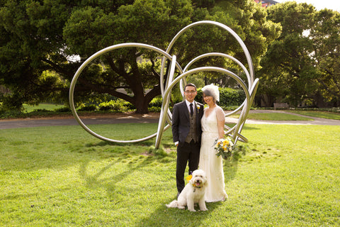 the bride and groom with their dog, wedding at UC Berkeley florals by Gorgeous and Green