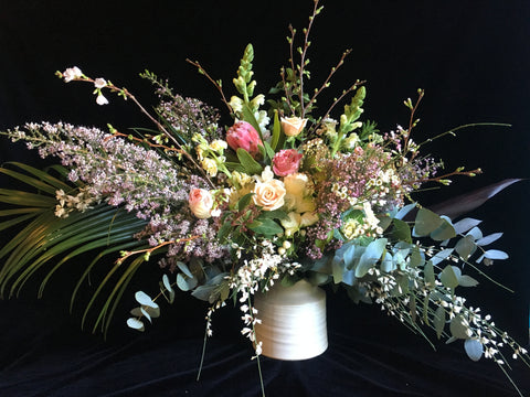 Wild and dramatic arrangement by Gorgeous and Green against a black velvet backdrop