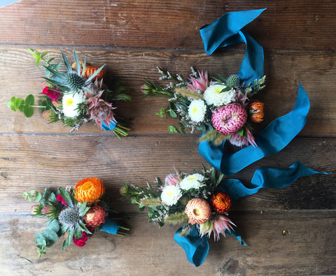 Yosemite rustic wedding wrist corsages and boutonnieres in teal and summer brights by Gorgeous and Green