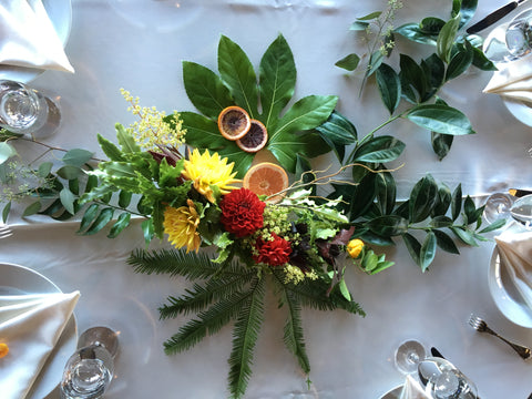 Wedding tablescape with citrus and leaves by Gorgeous and Green.