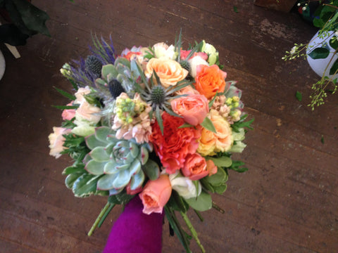 succulent and garden rose bridal bouquet in peach and coral and blue by Gorgeous and green