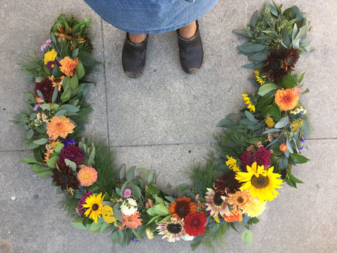 Flower garland for their wedding arch by Gorgeous and Green