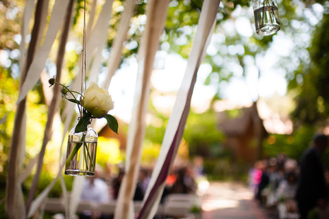 Hanging ribbons and bottles with blooms for the Ceremony at the Mill Valley Outdoor Art Club