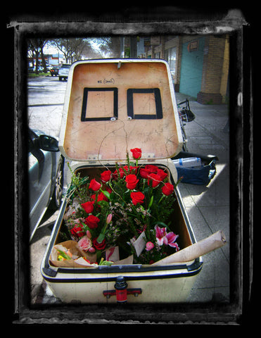 Bike courier with a bike loaded with Valentines Day deliveries for Gorgeous and Green