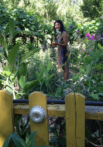 Me, Pilar Zuniga foraging for blooms and foliage in a friend's garden in Boise