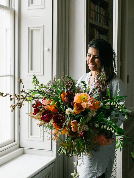 Pilar Zuniga of Gorgeous and Green with hand tied bouquet at Ponderosa Workshop