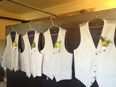 Various golden yellow boutonnieres by Gorgeous and Green for a wedding at Marin Headlands