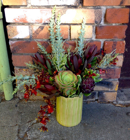 artichokes and succulents for an office arrangement