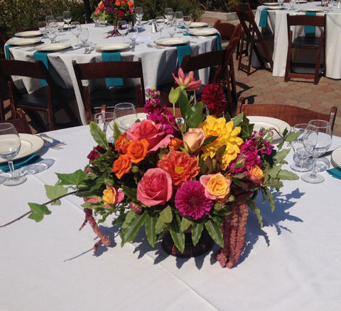 Colorful tuscan style arrangements for a wedding at St Vincent's School for Boys