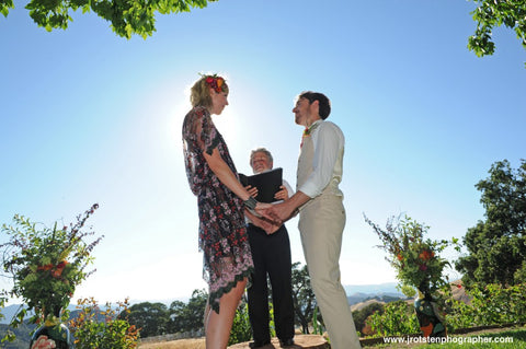 The couple at the Ceremony outside at Diablo Ranch, florals by Gorgeous and Green
