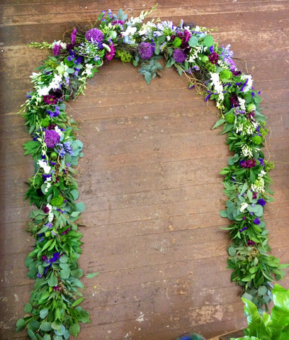 long floral garland for a wedding arch by Gorgeous and Green
